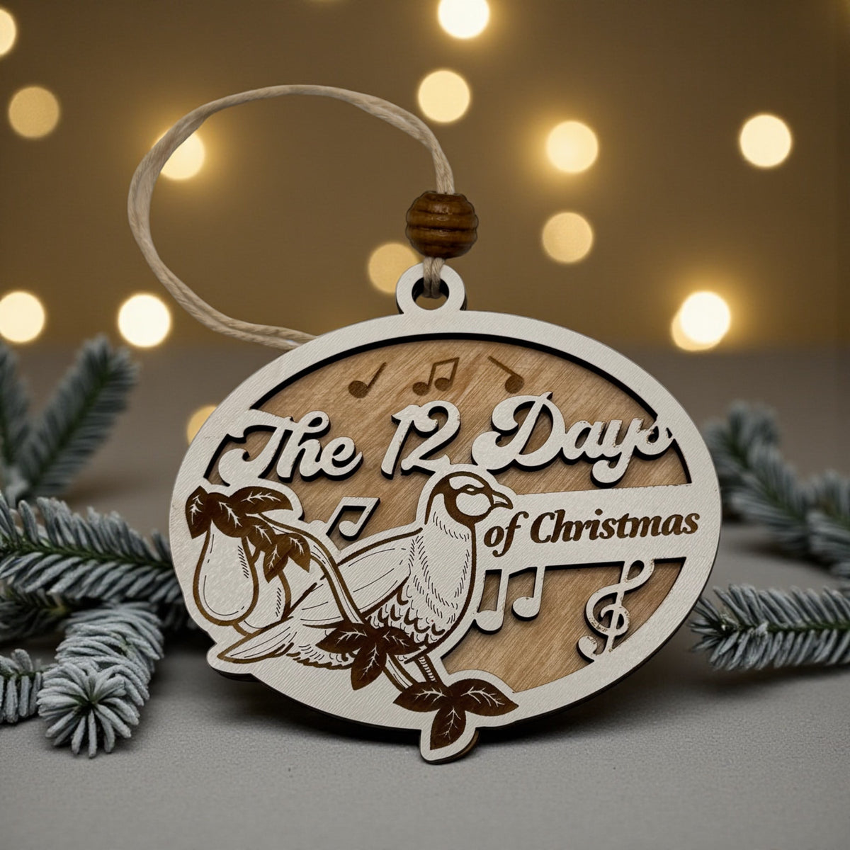 Wooden oval ornament engraved with a Twelve Days of Christmas scene, hanging against warm out-of-focus lights