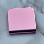 Pink magnetic hat clip with a removable golf ball marker