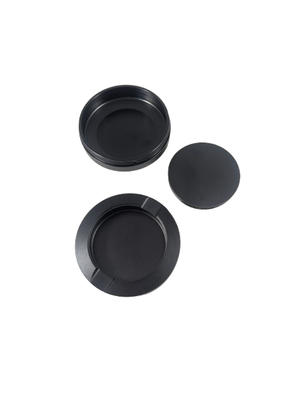 Black aluminum dip can shown open with the lid set beside it