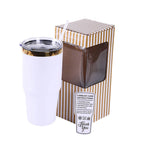 White 30 oz. tumbler with a gold plated lid, shown with its gift box