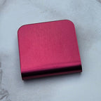 Maroon magnetic hat clip with a removable golf ball marker