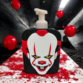 Soap dispenser cover painted as a creepy clown face with red balloons on a dark background