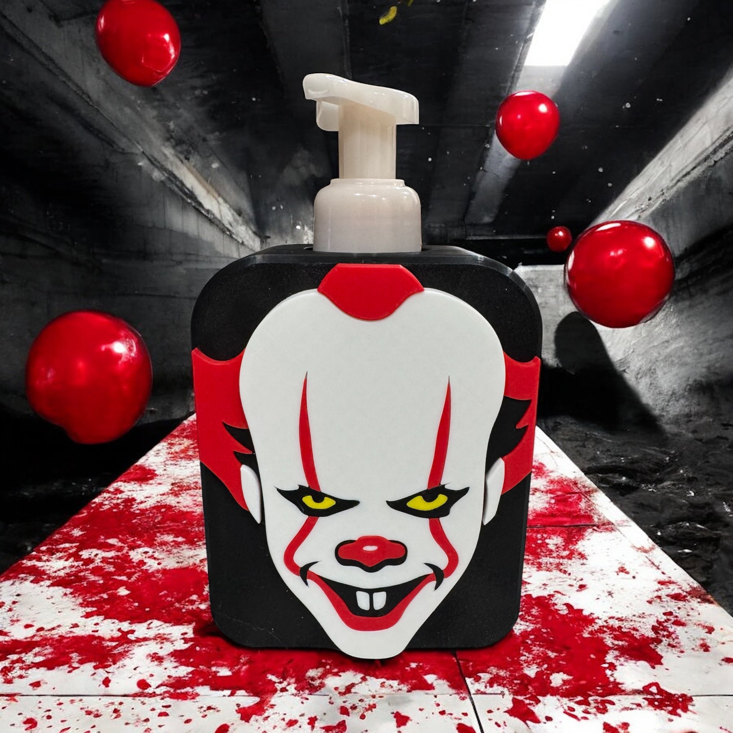 Soap dispenser cover painted as a creepy clown face with red balloons on a dark background