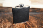 Heritage Black leatherette hip flask, solid black with black stitching and a stainless steel cap