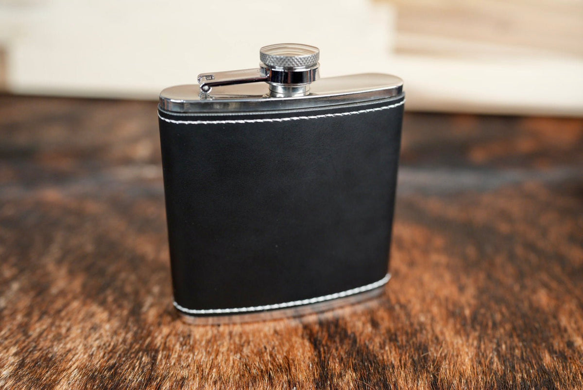 Black/Silver leatherette hip flask, black with a silver band at the top and bottom edges