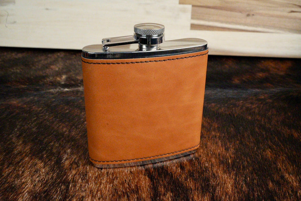 Buckskin leatherette hip flask in a light golden tan with a stainless steel cap