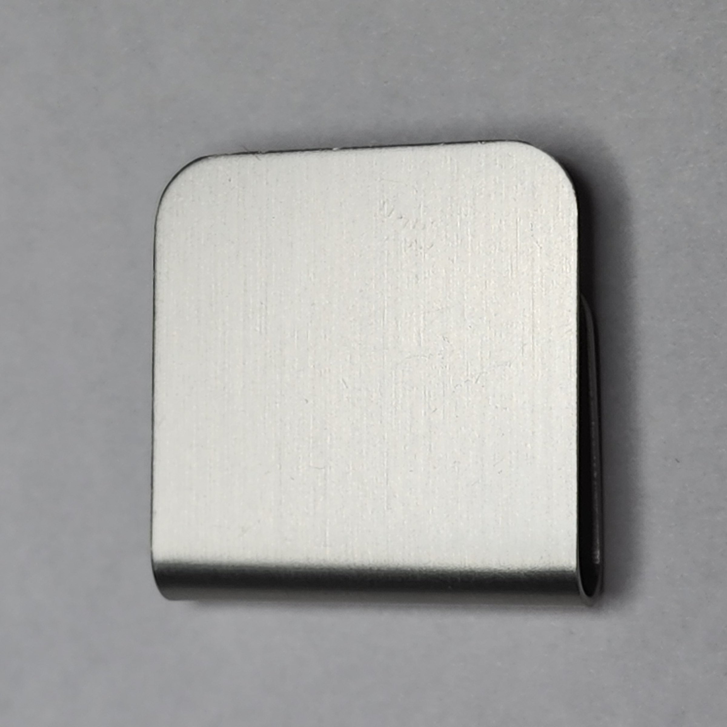 Silver magnetic hat clip with a removable golf ball marker