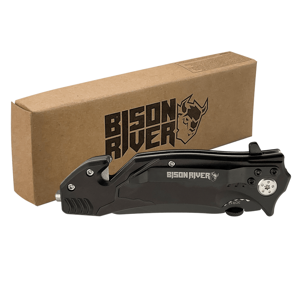 Black Bison River rescue knife with a belt clip, shown closed beside its kraft Bison River gift box