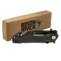Black Bison River rescue knife with a belt clip, shown closed beside its kraft Bison River gift box
