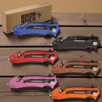 Six Bison River rescue knives fanned out on a wooden surface in blue, red, pink, black, wood and orange, each in front of its kraft gift box