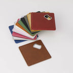 Leatherette coaster with a built-in stainless steel bottle opener — custom engraved bottle opener coaster by Solano Laser Craft