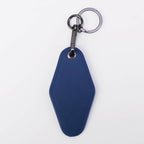 Navy leatherette motel keychain with a swivel clip and split ring