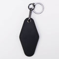 Black leatherette motel keychain with a swivel clip and split ring