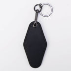 Black leatherette motel keychain with a swivel clip and split ring