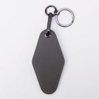 Gray leatherette motel keychain with a swivel clip and split ring