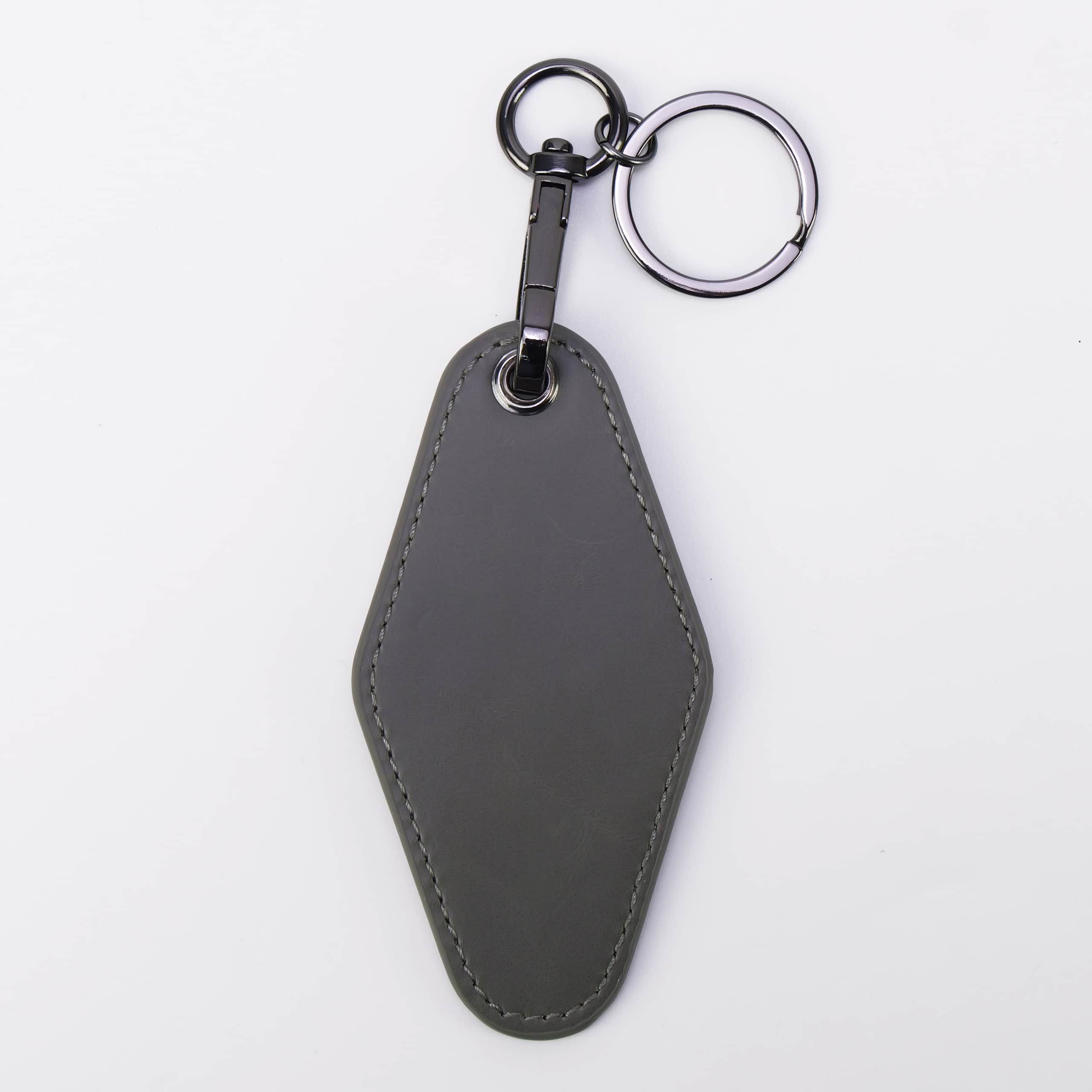 Gray leatherette motel keychain with a swivel clip and split ring