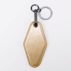 Metallic gold leatherette motel keychain with a swivel clip and split ring