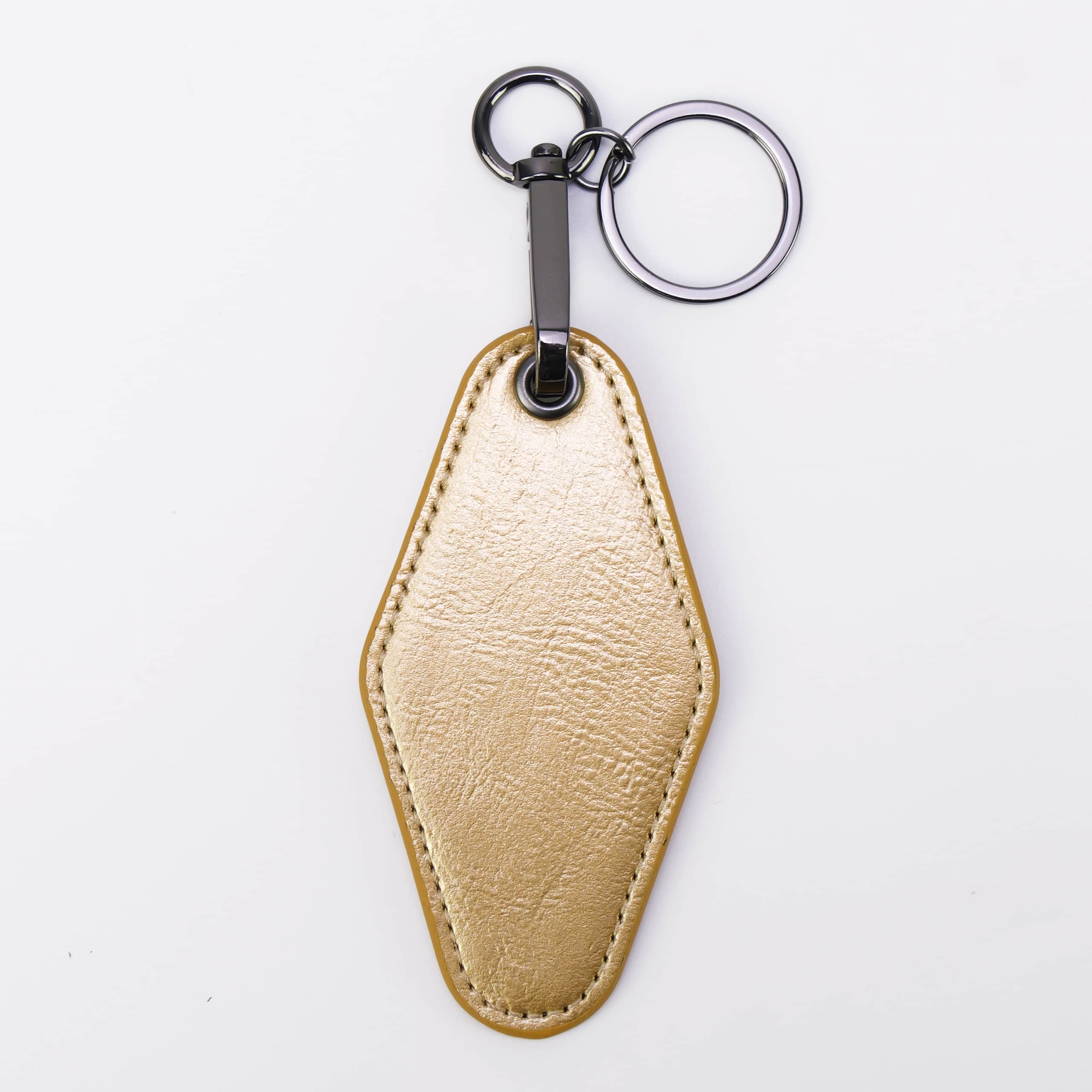 Metallic gold leatherette motel keychain with a swivel clip and split ring