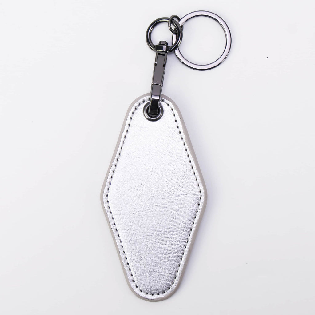 Metallic silver leatherette motel keychain with a swivel clip and split ring