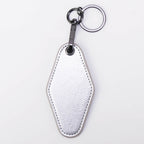Metallic silver leatherette motel keychain with a swivel clip and split ring
