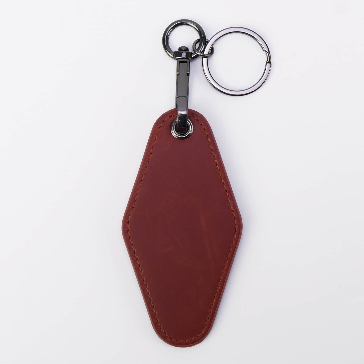 Red leatherette motel keychain with a swivel clip and split ring