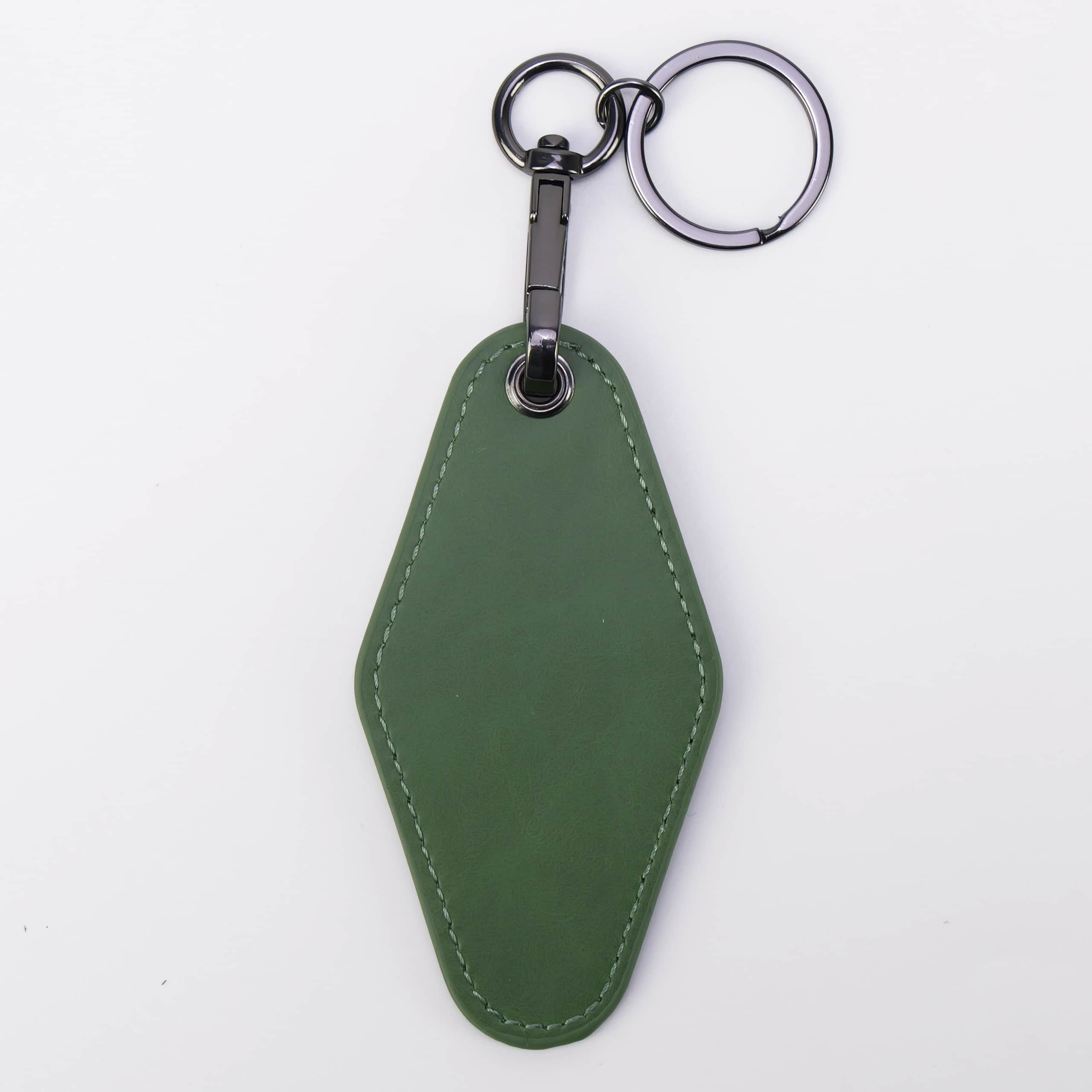 Sage green leatherette motel keychain with a swivel clip and split ring