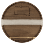 Round acacia serving tray with a white pearl resin river and engraved design on the wood
