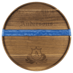 Large round acacia serving tray with blue pearl resin river and engraved family name and crest