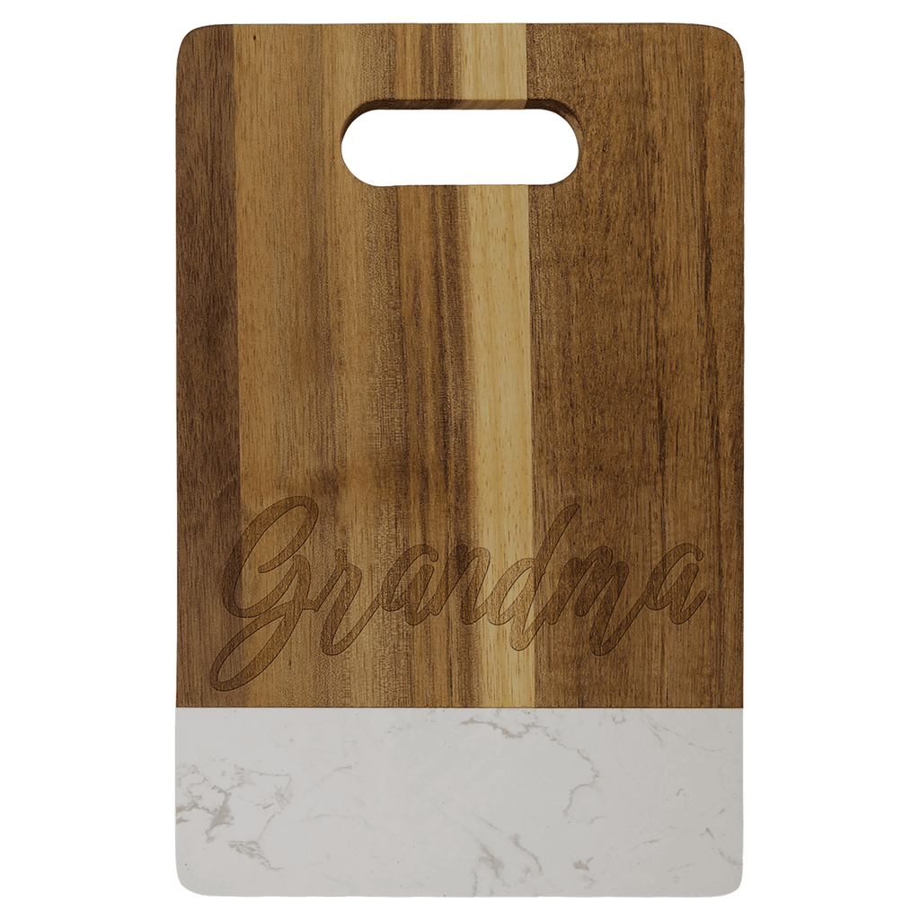 Small acacia cutting board with white marble band and cut-out handle, engraved on the wood