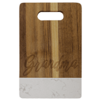 Small acacia cutting board with white marble band and cut-out handle, engraved on the wood