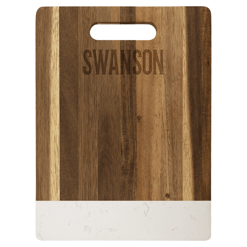 Medium acacia cutting board with white marble band, engraved family name on the wood