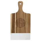Paddle shaped acacia board with white marble band and engraved monogram
