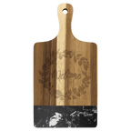 Paddle shaped acacia board with black marble band and engraved wreath design
