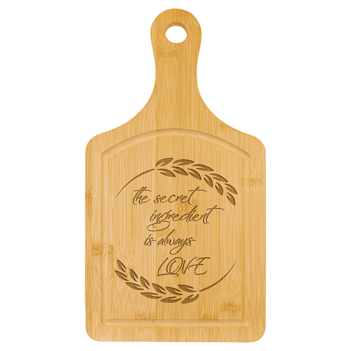 Bamboo paddle board engraved with a script quote about cooking with love