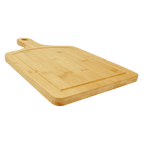 Angled view of a bamboo paddle board showing the depth of the juice groove