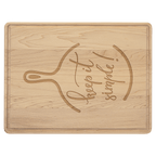 Maple cutting board engraved with 'keep it simple' and a spatula and skillet design