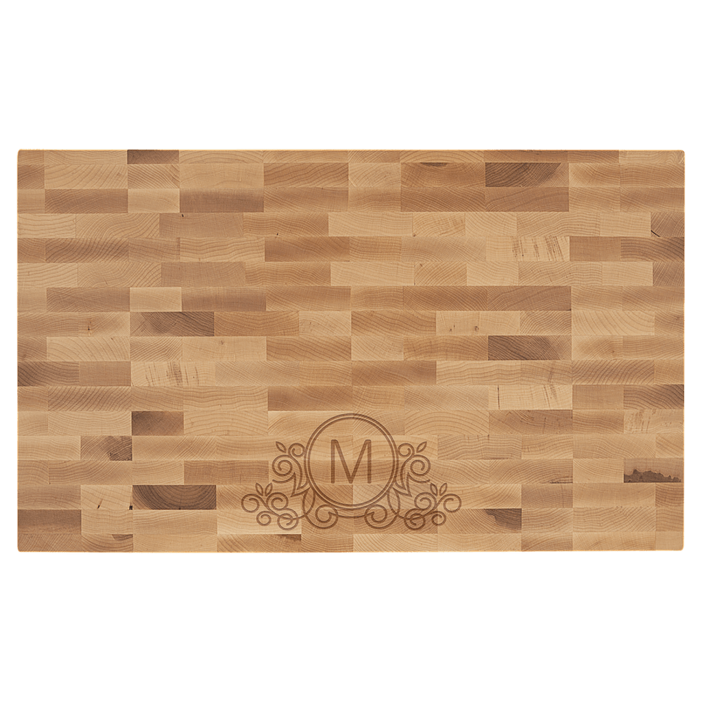 Maple butcher block engraved with an M monogram and flourish