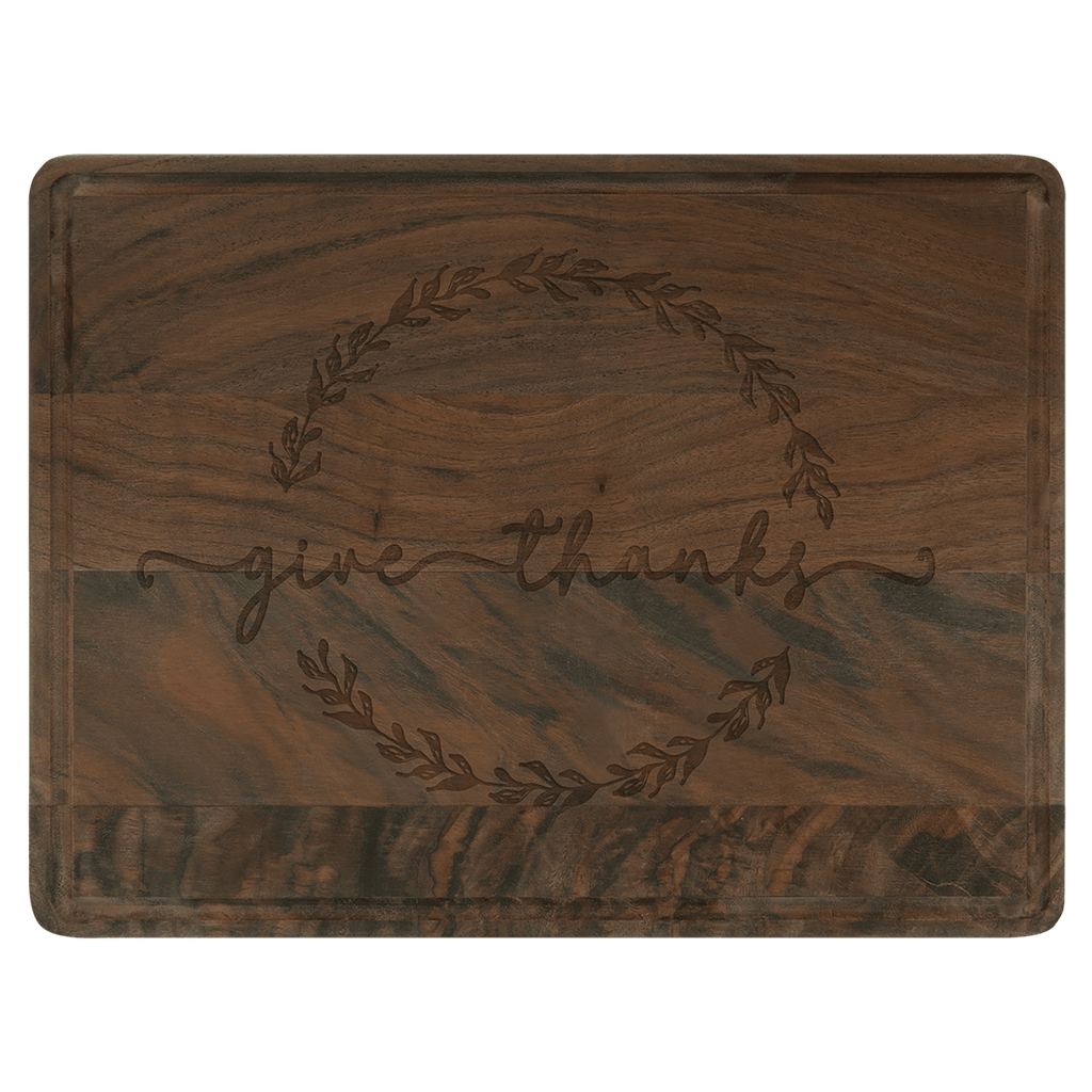 Walnut cutting board engraved with 'give thanks' inside a wreath