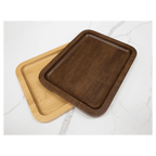 Walnut tray stacked on an alder tray on a marble counter