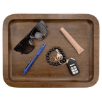 Walnut tray holding sunglasses, a pen, keys and a bracelet