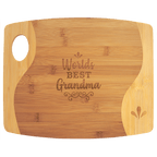 Two-tone bamboo cutting board engraved with 'World's Best Grandma'