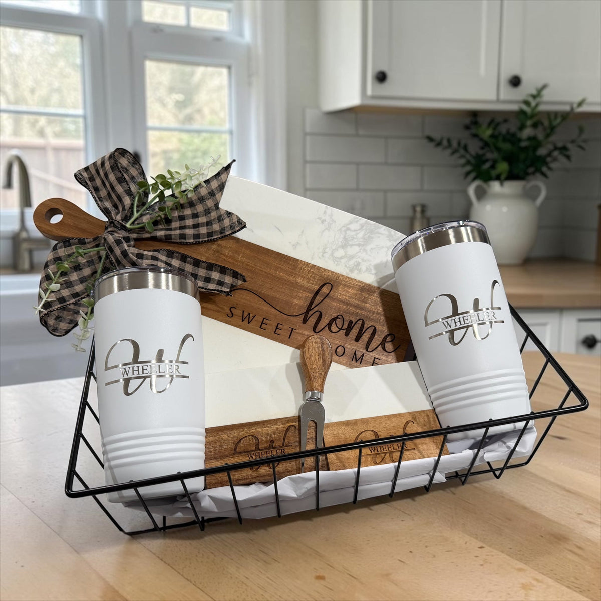 Closing gift basket shown from a second angle with the engraved board and coaster set