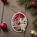 Wooden oval ornament engraved with a Jolly Old St. Nicholas scene, hanging against a pine bough with red baubles