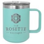 Teal powder-coated 15 oz. insulated coffee mug with a handle, stainless steel rim and clear slider lid, shown with a sample engraving