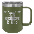 Olive green powder-coated 15 oz. insulated coffee mug with a handle, stainless steel rim and clear slider lid, shown with a sample engraving