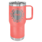 Coral powder-coated 20 oz. insulated travel mug with a handle, stainless steel band and clear slider lid, shown with a sample engraving