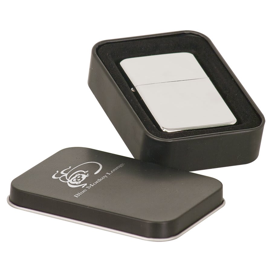 Chrome lighter shown with its black metal presentation tin