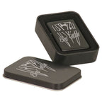 Matte black lighter shown with its black metal presentation tin