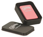 Matte pink lighter shown with its black metal presentation tin