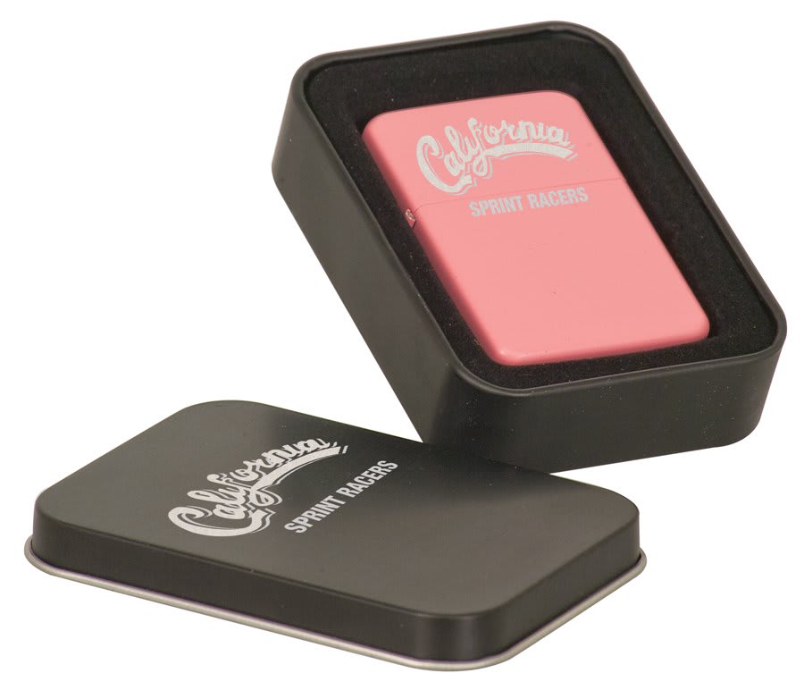 Matte pink lighter shown with its black metal presentation tin